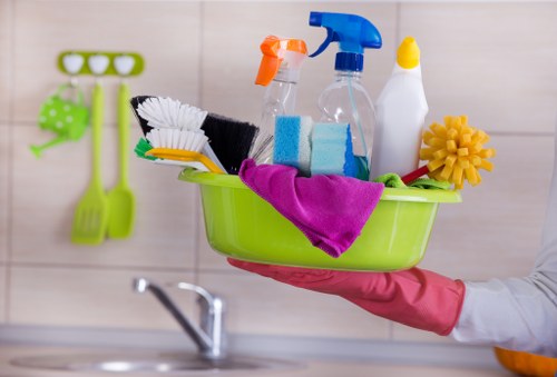 Cleaning professional using safe work practices in a commercial environment